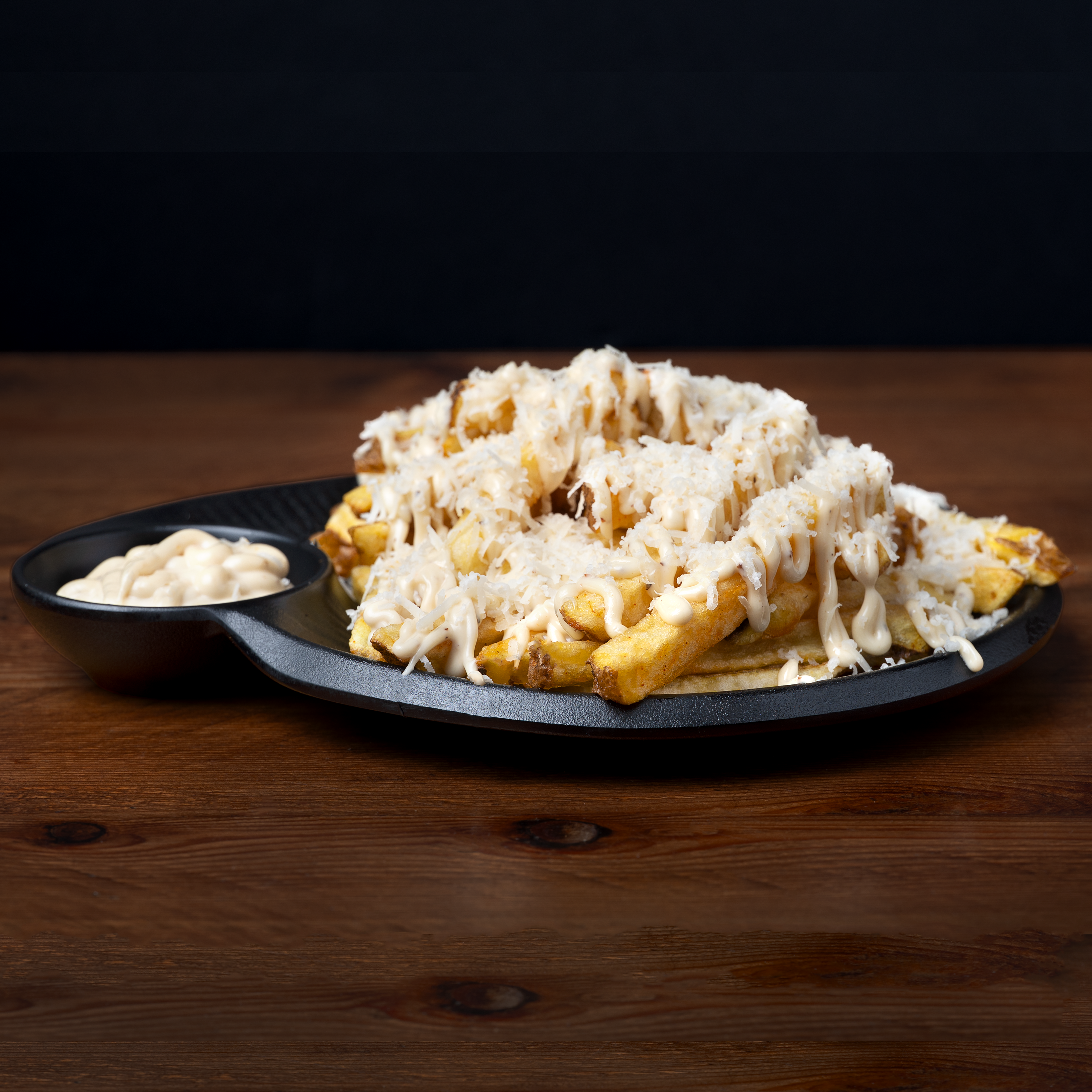 Patatas fritas con trufa y parmesano